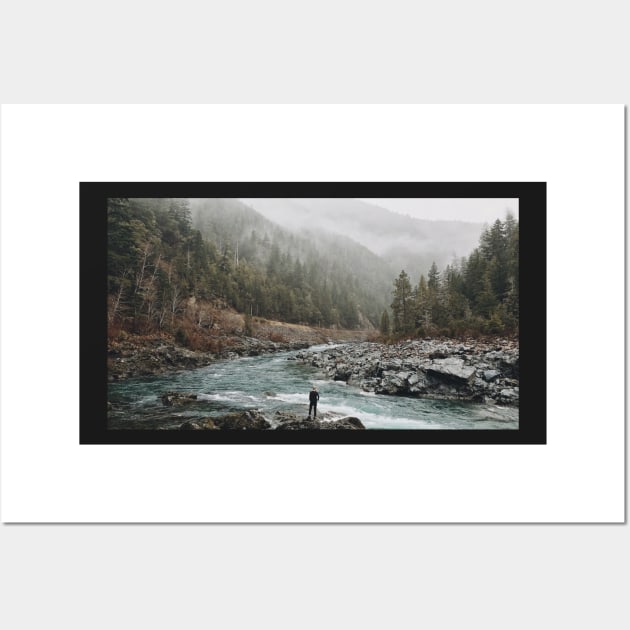 A man standing on jagged rocks in a fast-flowing river in the wilderness Wall Art by T-SHIRT-2020